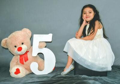 girl posing for birthday portrait
