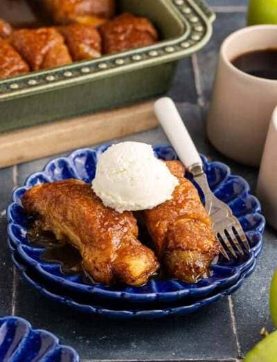 plate of apple dumplings topped with ice cream