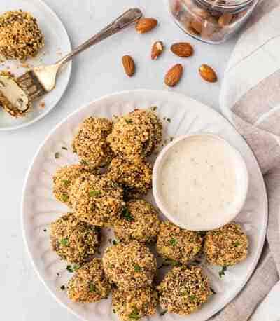 plate of almond crusted mushrooms with a cup of ranch dressing
