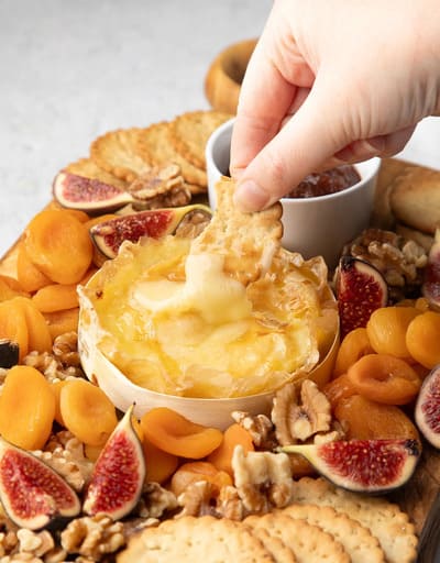 baked brie on a charcuterie board