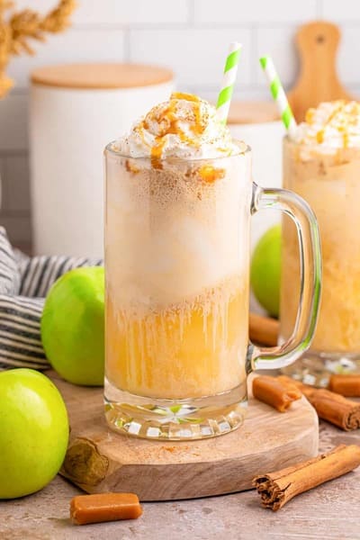 glass mugs of apple cider floats